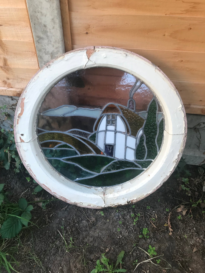 1920's Circular Lead Light Window depicting a Cottage Scene.